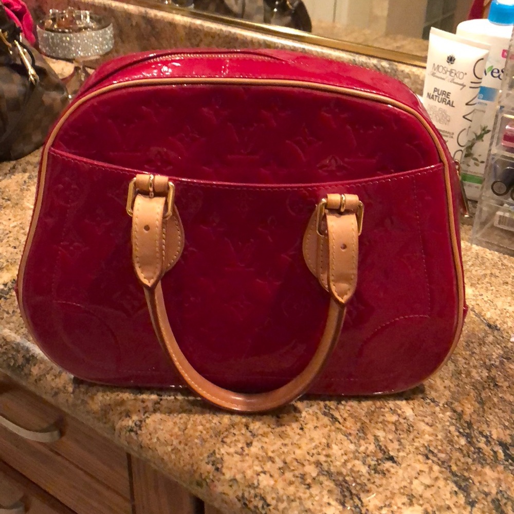 Authentic red monogram Louis Vuitton purse.